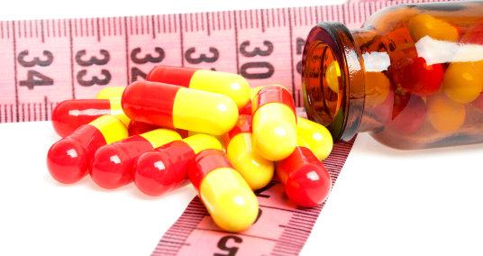 Foto (kleur) medicijnen op meetlint
